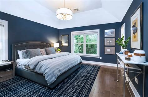 black bedroom furniture with blue walls
