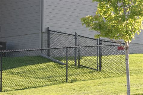 black chain link fence posts