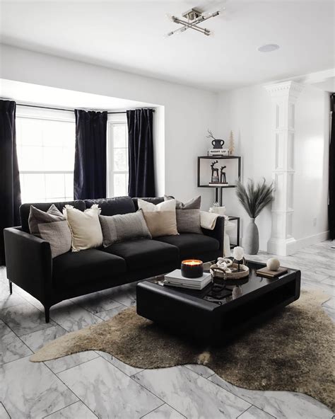 Black couch in living room with ambient lighting
