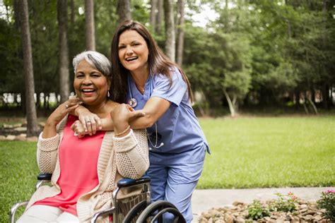 Blessed Home Health Care caregiver assisting a senior woman