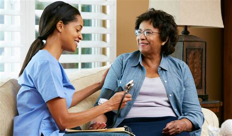 Blessed Home Health Care staff helping a patient
