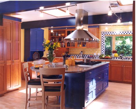 Blue and yellow kitchen. I like the creative tile backsplash