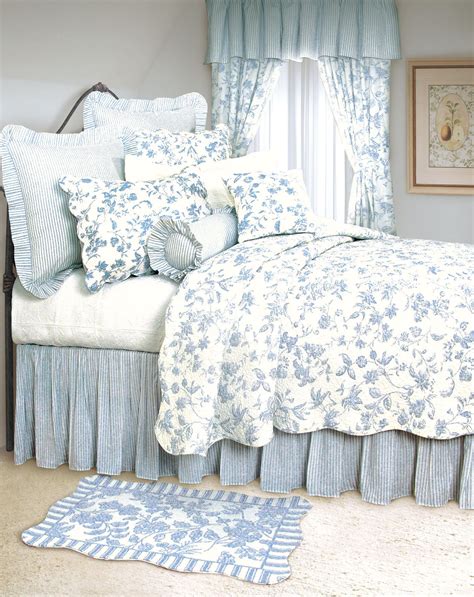 blue and white bedroom with patterned bedding
