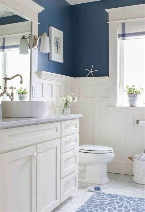 blue bathroom with an accent wall