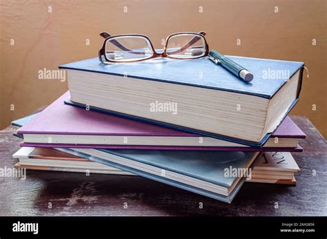 books pen and glasses