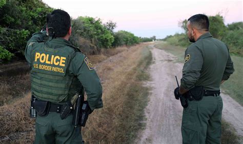 border patrol stands with texas