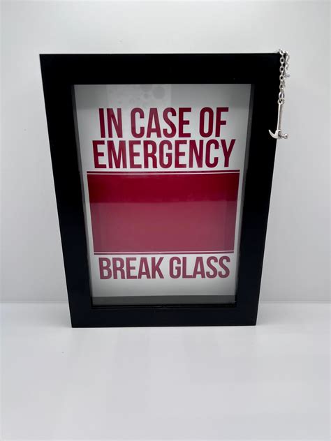 Empty red emergency box with in case of emergency breakable glass. Square format. Rescue