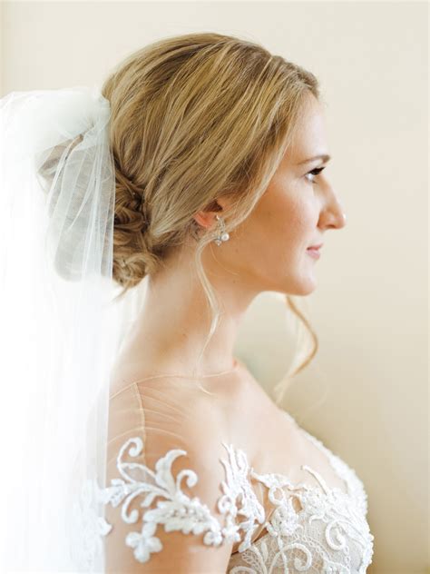 This Bridal Hair Updo With Veil And Tiara For Long Hair