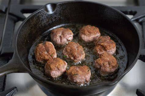 Browning meatballs in a pan
