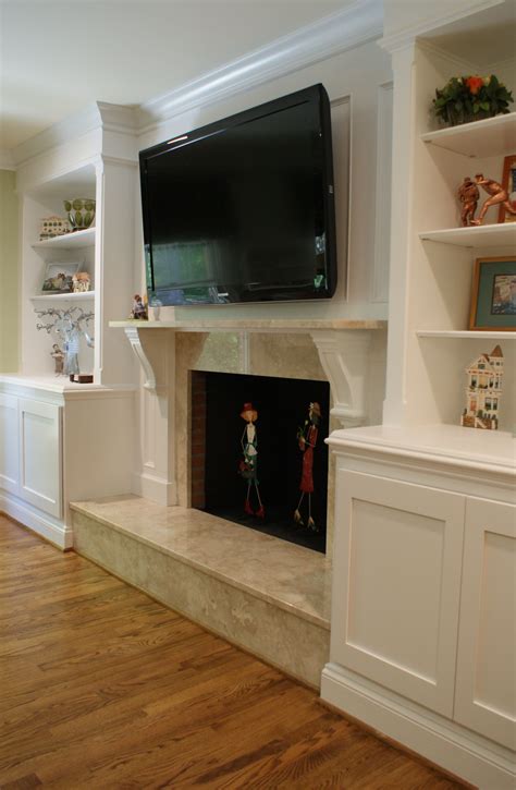 built in shelves on either side of fireplace