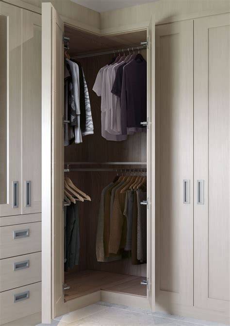 Curved fitted corner wardrobe hand painted in a cream www
