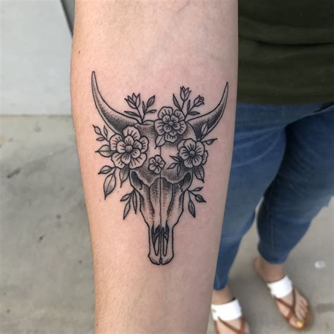 bull skull tattoo with flowers