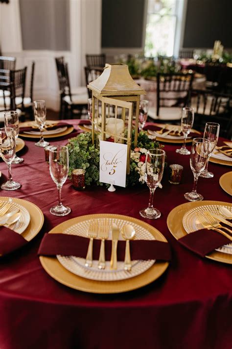 Burgundy crushed linen, with gold charger, burgundy napkin, gold
