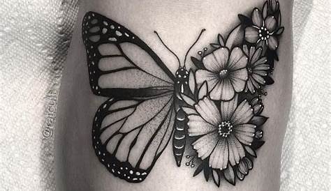 Half butterfly half flower tattoo on the bicep.