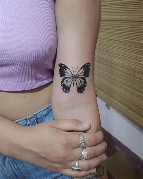 butterfly inner bicep tattoo