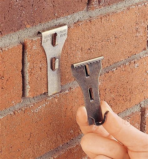 Cable Clips In Brick Wall