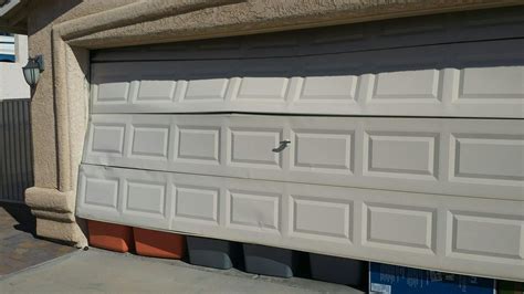 Can a Dent in Your Aluminum or Steel Garage Door be Repaired? Garage