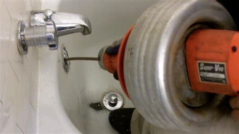 RIDGID K1 Combination Auger Breaks through Blocked Urinals, Shower