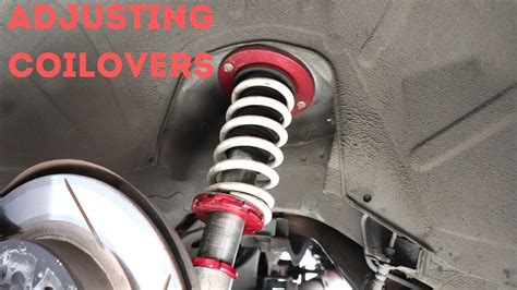 How do I adjust the ride height on these coilovers while they are on my car. There is only two
