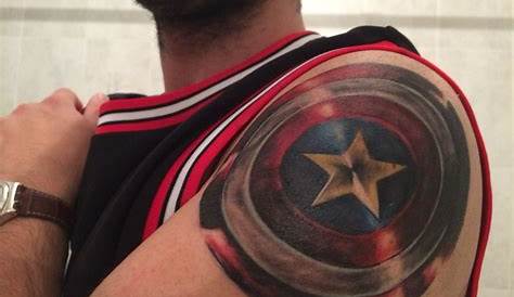 Captain America shield shoulder tattoo by Orlando
