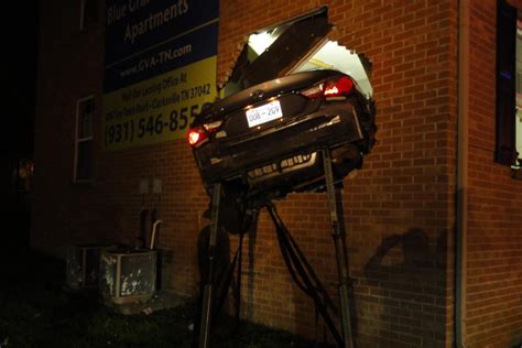 car crashes into apartment building