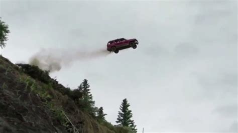 car drives off cliff