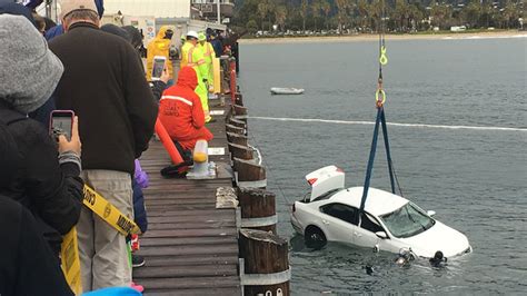 car drives off pier