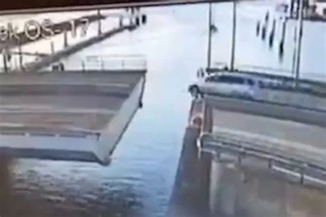 car falling off bridge into water