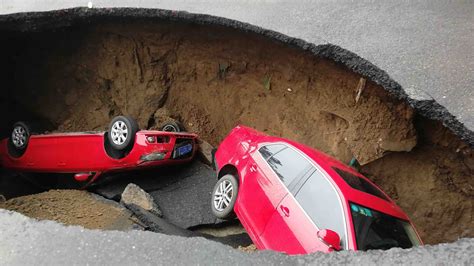 car falls into sinkhole