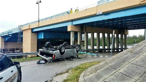 car falls off bridge