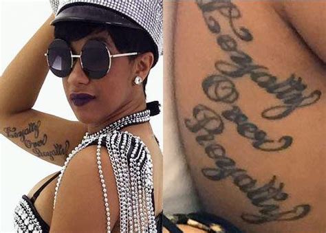 A fan gets Cardi B's picture tattooed on her hand