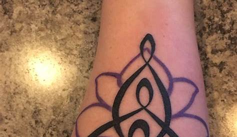Celtic symbol for motherhood with a turquoise dot for my son! It looks