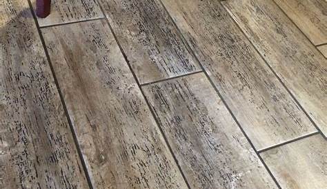 I LOVE this floor! It's tile that looks like wood. I bet it wears like