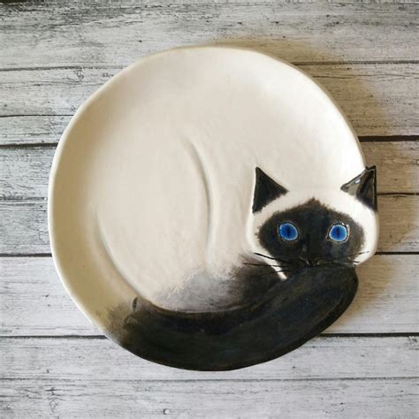 ceramic pottery plate with cat portraits