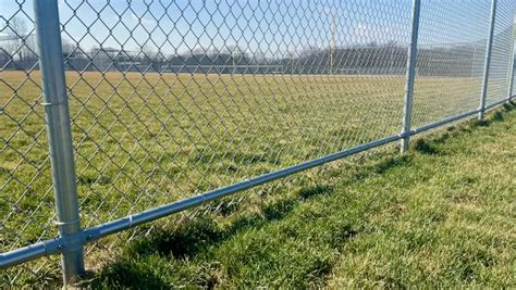 Galvanized chain link rail. Installed by Titan Fence & Supply Company. Fencing companies