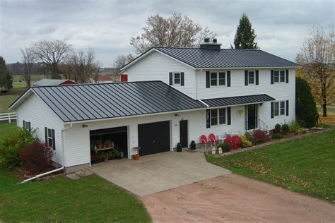 home.furnitureanddecorny.com:charcoal grey metal roof white brick house