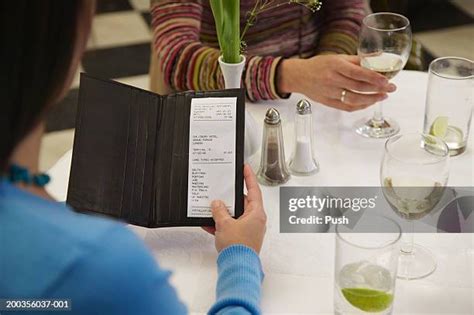 checking bill at restaurant