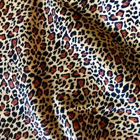 Cali Fabrics Cheetah Print on Bright Vertical Rainbow Stripe ‘Tutti