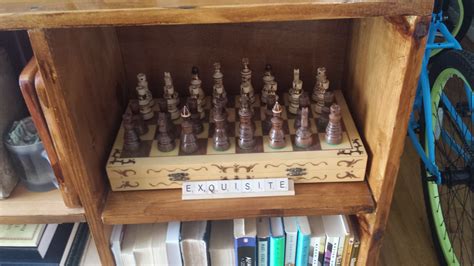 Chess Set On Bookshelf