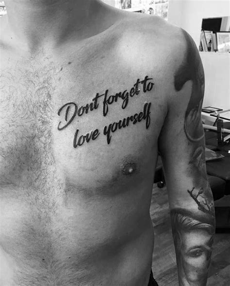 Word and Quote chest tattoo men ideas