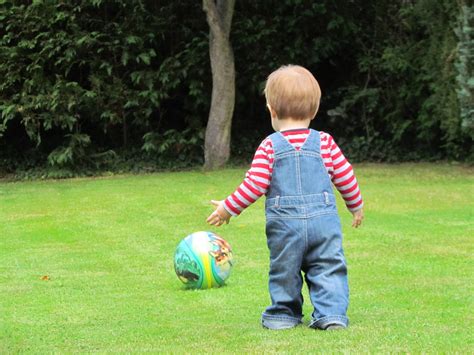 child playing in lawn