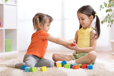 child sharing toys