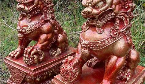 PAIR OF CHINESE CARVED IVORY FOO DOGS
