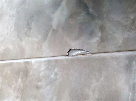 chipped tile on kitchen floor