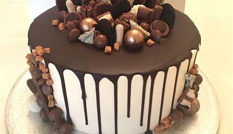 a cake with chocolate frosting and candies on top