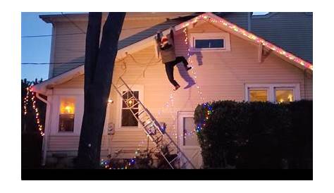 Christmas Decoration Guy Hanging From Roof Kind Man Called For Help Seeing