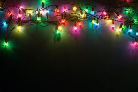 Mesmerizing Christmas Lights on a Black Background: Illuminating Your Holiday Décor with Elegance