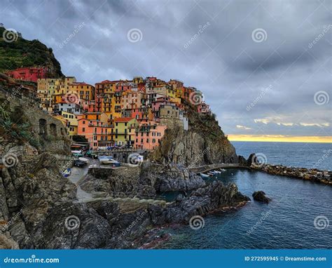 An aerial view of the Cinque Terre coastline, with the villages nestled against the cliffs and overlooking the azure sea.