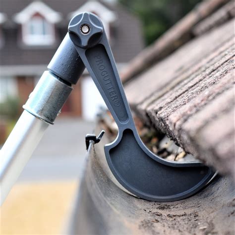 cleaning gutters with tools