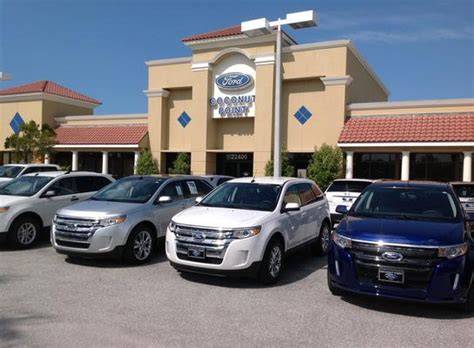 Coconut Point Ford Estero dealership exterior with a selection of Ford vehicles